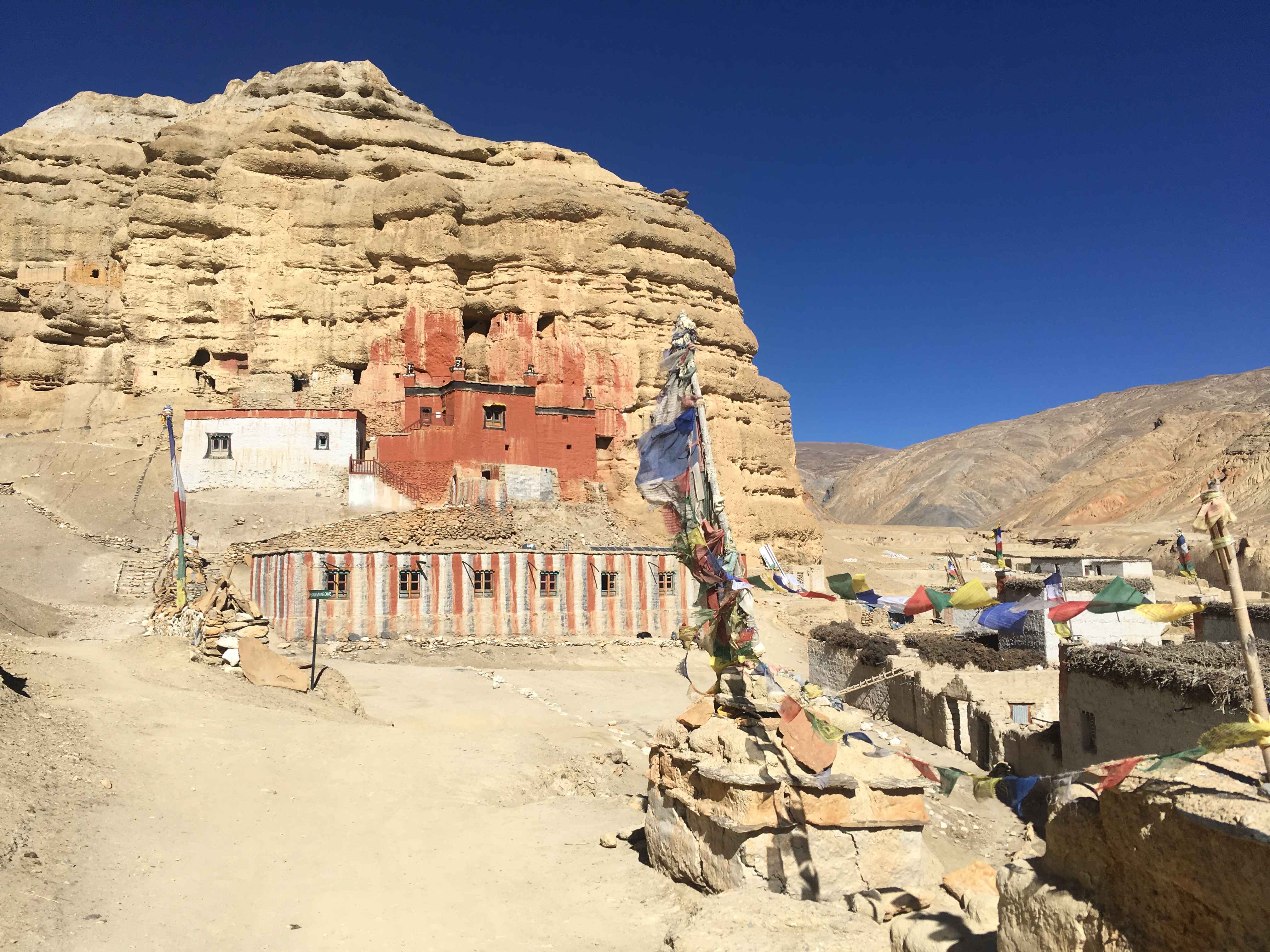 The Niphu Monastery in red color, of Chosser, Mustang is the only monastery which is caved inside a huge cliff.