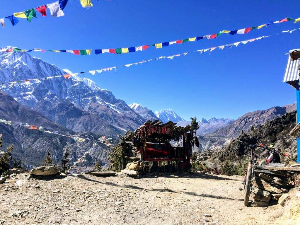 A little Tibetan souvenir shop looks amazing with the views of the mountains and the colorful hues flapping above.