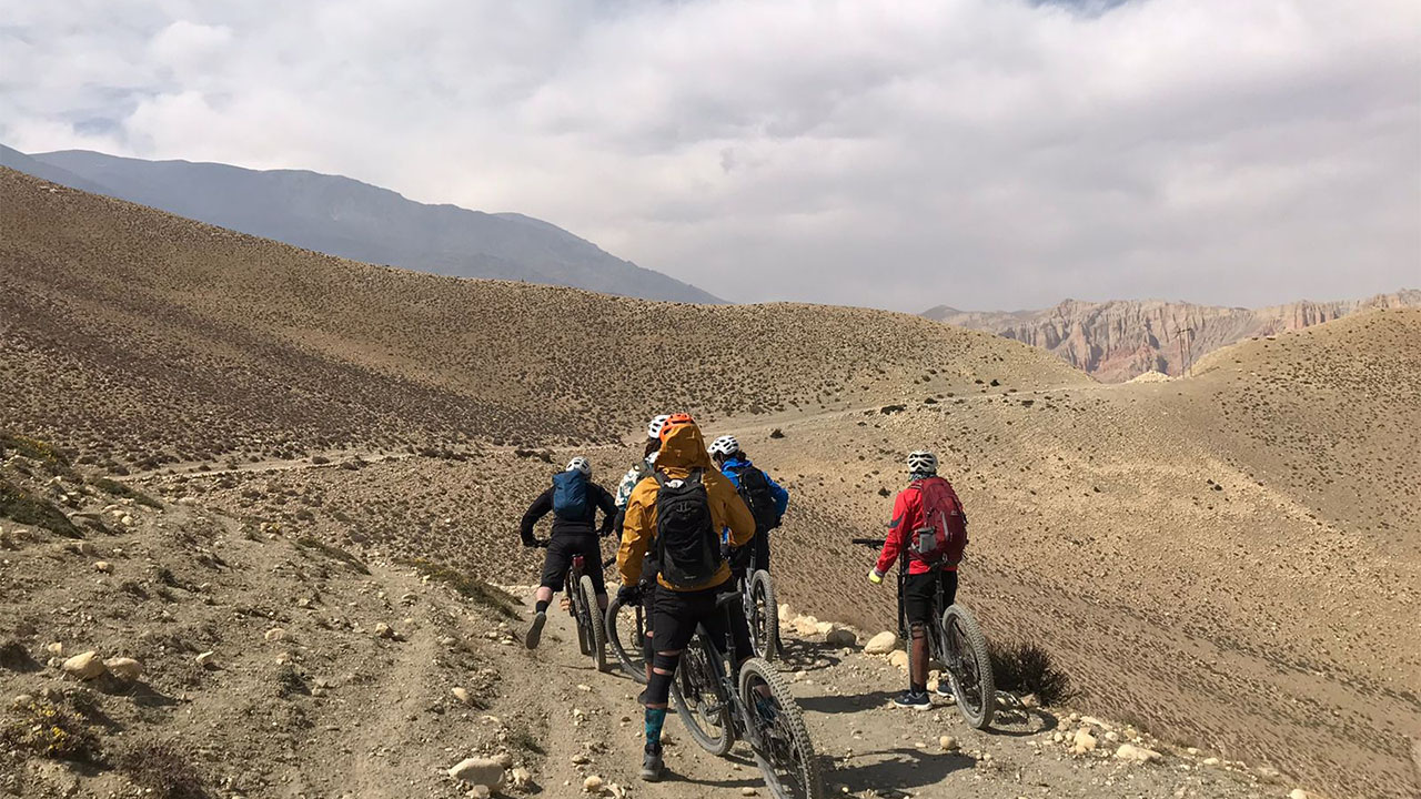 Group of mountain bikers getting ready to kick-off on the single track of Mustang.