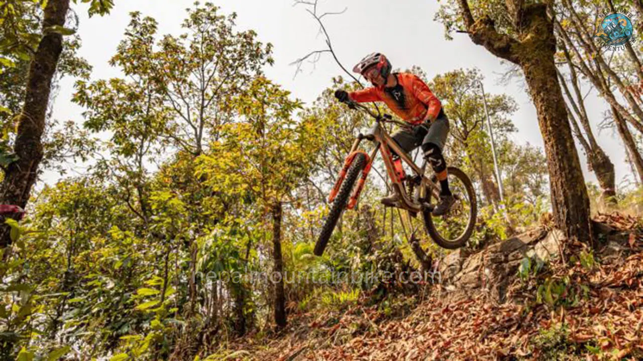 Mountain biker maneuvers the bike during the Enduro MTB tour in Nepal with Nepal MTB Adventures.