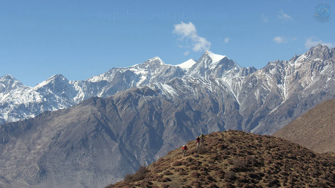 Mountain bikers are shredding the Lupra trail in Mustang during enduro MTB guided tour in the Himalayas of Nepal.
