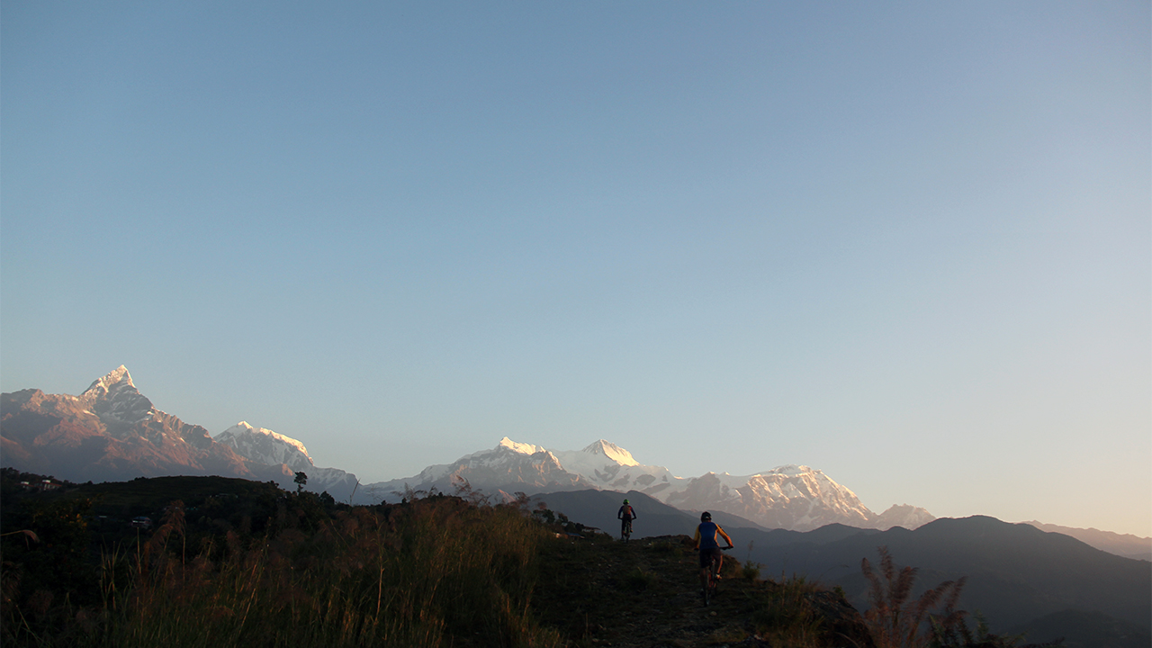 Mountain bikers enjoying the views of Himalayas while pedaling to Sarangkot, Pokhara