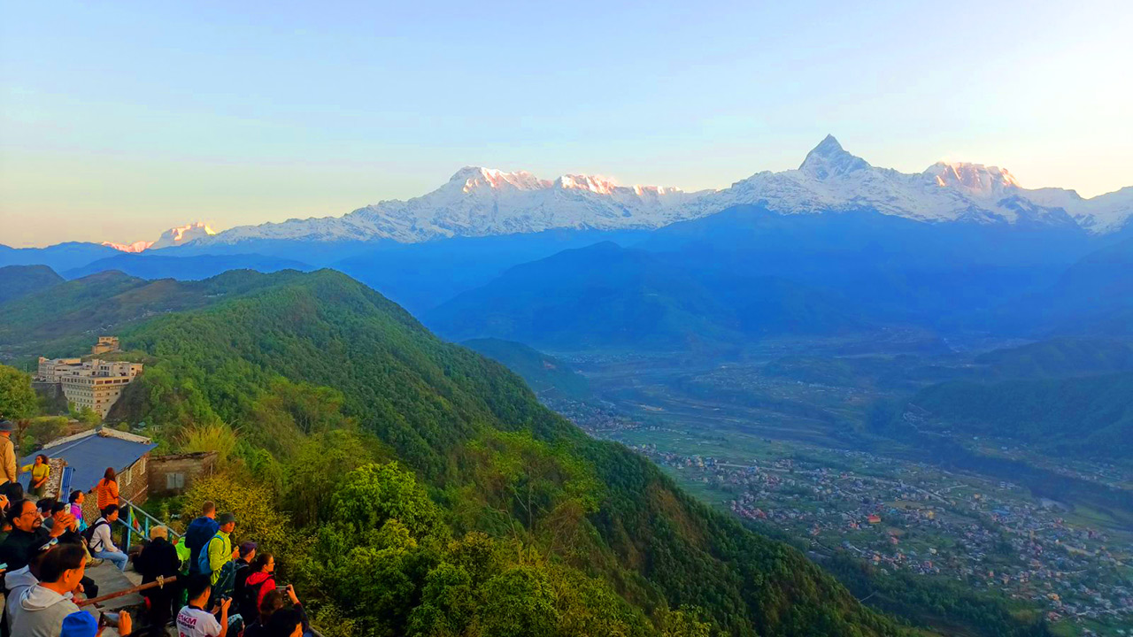 People are observing the sunrise view over Annapurna and Dahulagiri mountain range from Sarangkot view point.