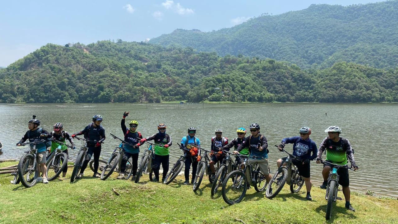 Cyclists cheering the incredible experience during the E_MTB guided tour in Pokhara, Nepal.