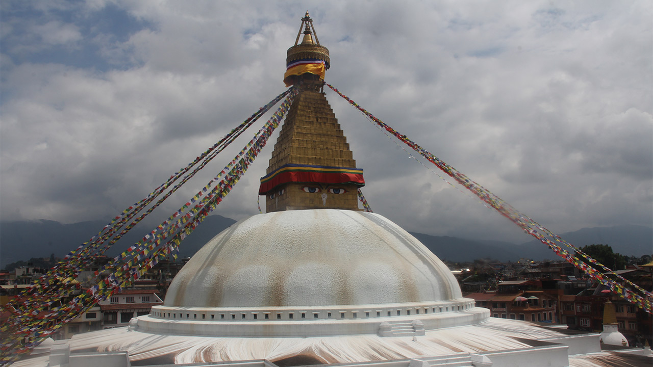 Boudhanath stupa of Kathmandu decorated with prayer flags.