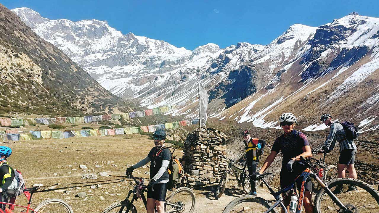 Mountain bikers taking rest during their Annapurna Circuit MTB tour.