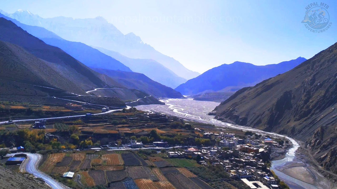 Kabeni village, Kaligandaki River and Nilgiri mountain captured during Mustang mountain bike tour with Nepal MTB Adventures. 