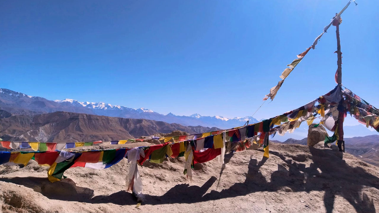 The background of Annapurna mountain range and the prayer flags make the arid landscape of Upper Mustang unique.